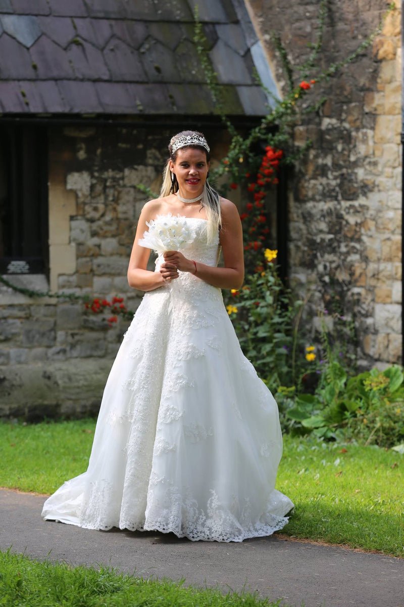 A line Wedding Dress with Beaded detail and a Long Train - Cerrura Fashions